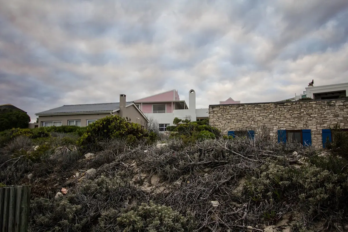 Arniston houses behind coastal fynbos dunes