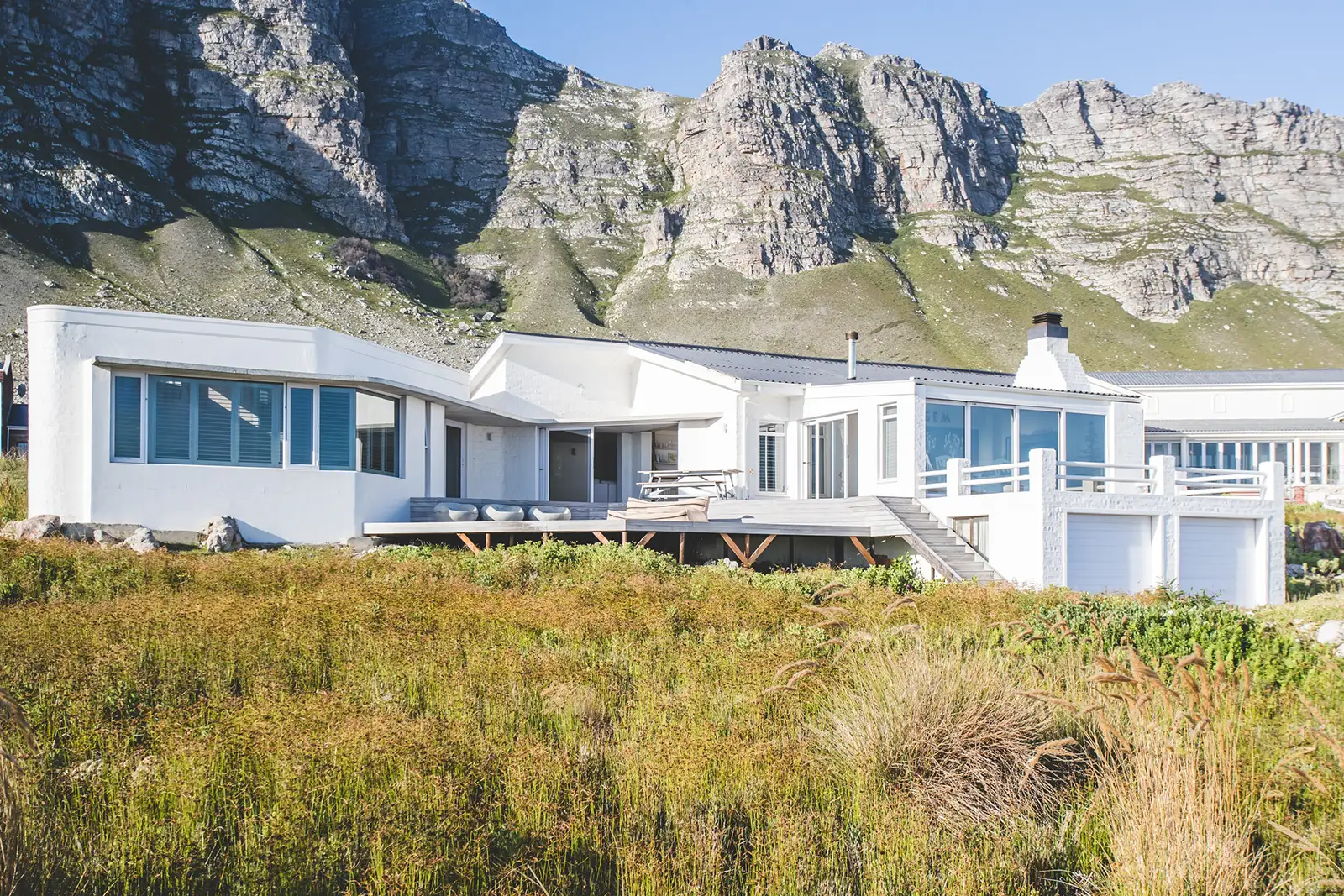 The house from the fynbos with the mountains behind