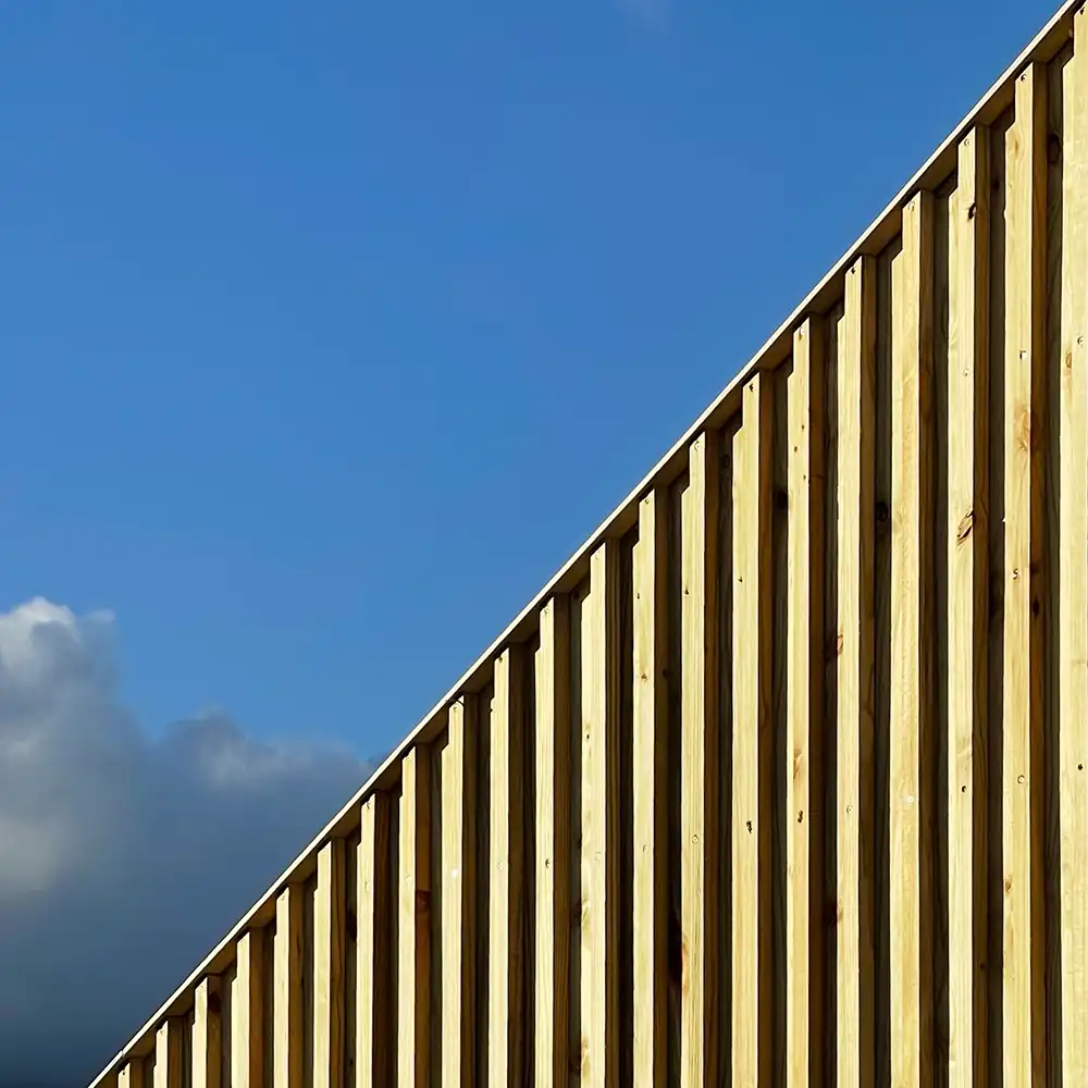 Detail of the vertical timber cladding against the sky