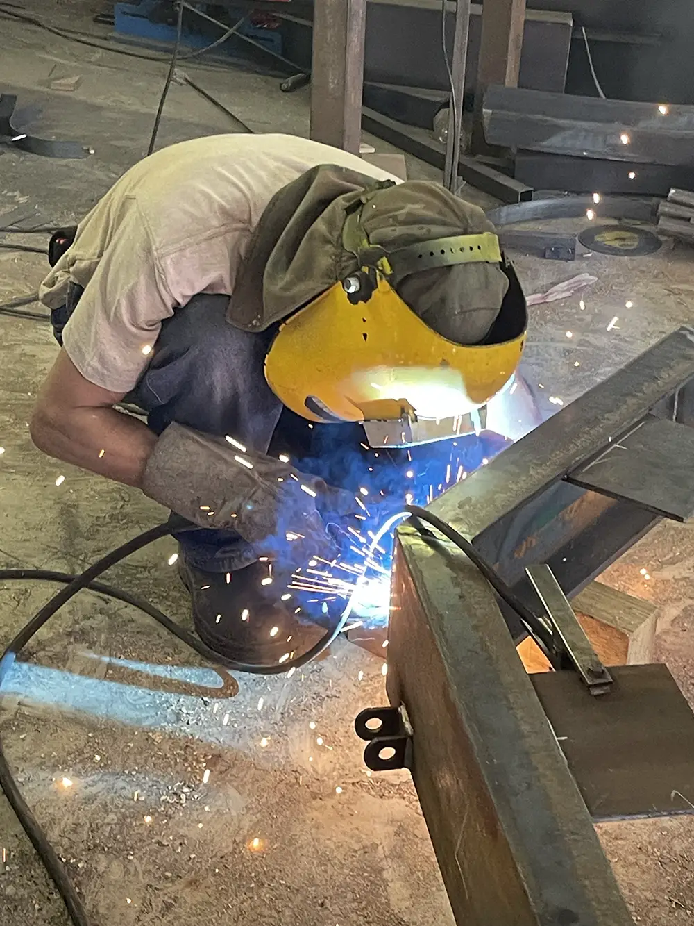 Welder working on the steel frame