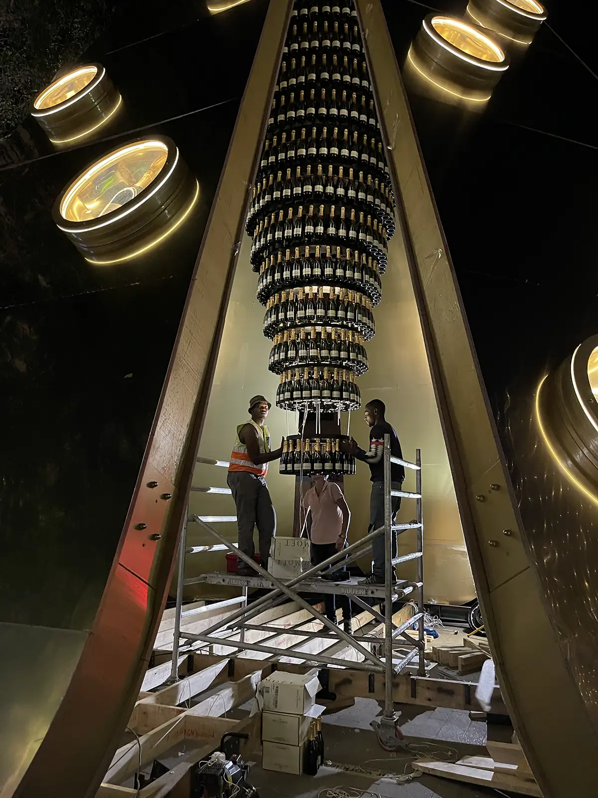 Inside the cone: the illuminated tower of bottles
